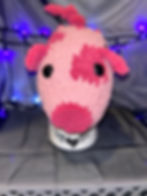 small pig with light pink and dark pink and black accents.