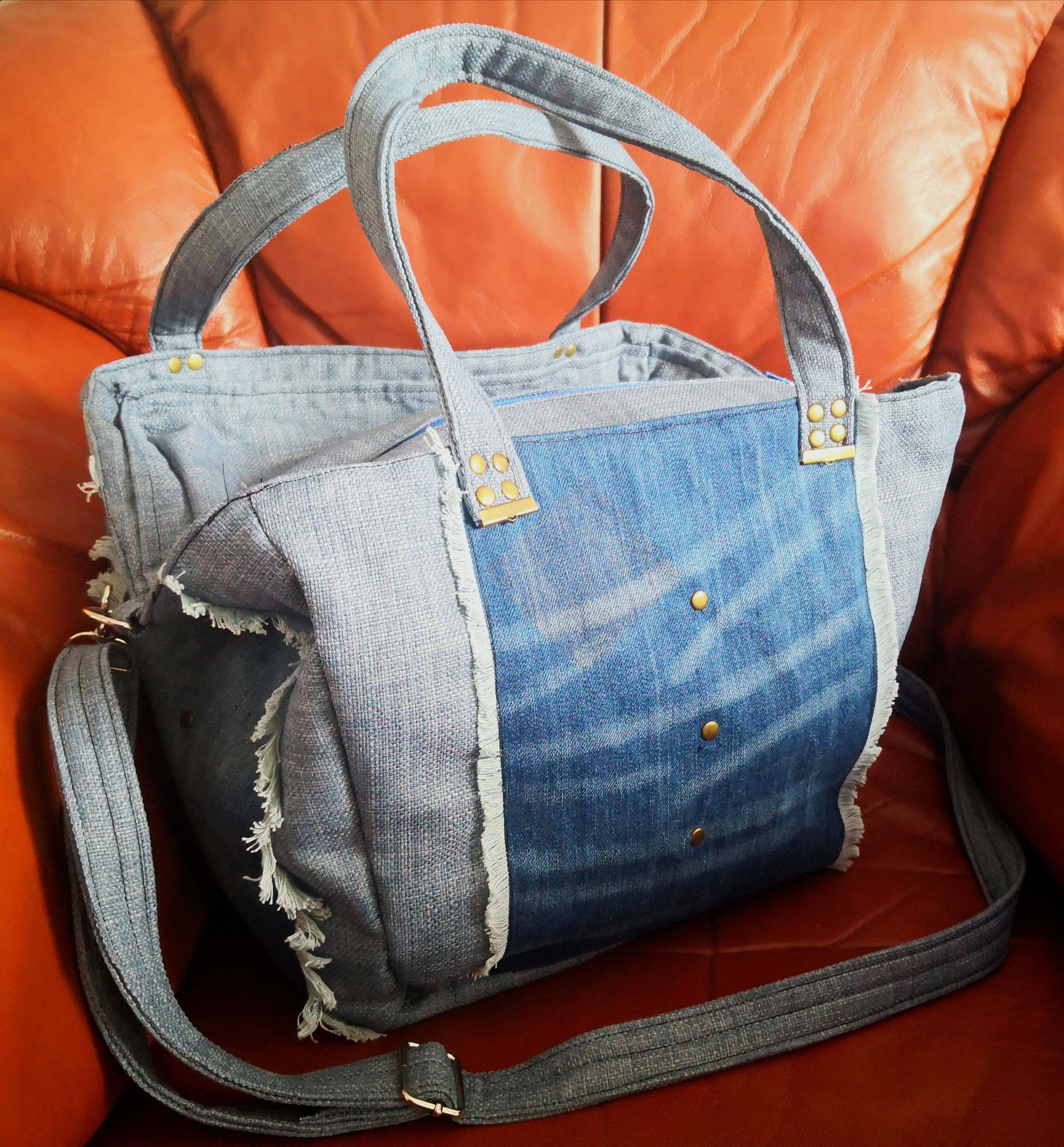 Denim panel water resistant shoulder bag