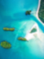 Aerial view of tropical islands for Asili Travel Advisory.
