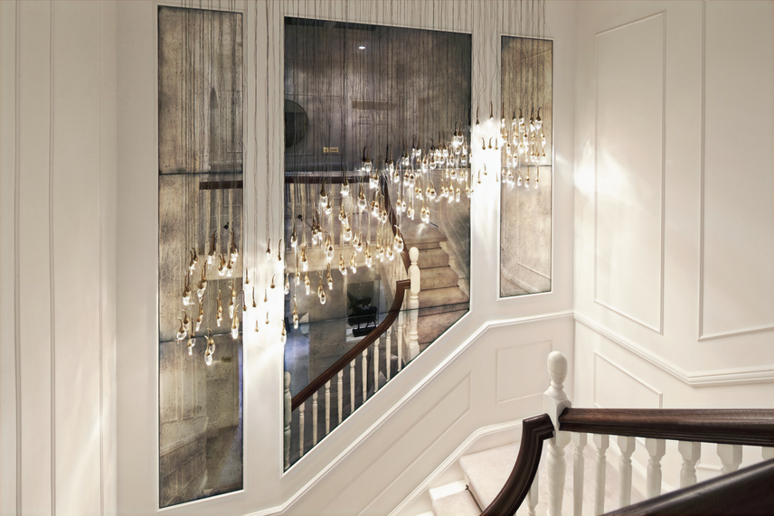 The property in Hale with Antique mirror and wall paneling above the grand staircase