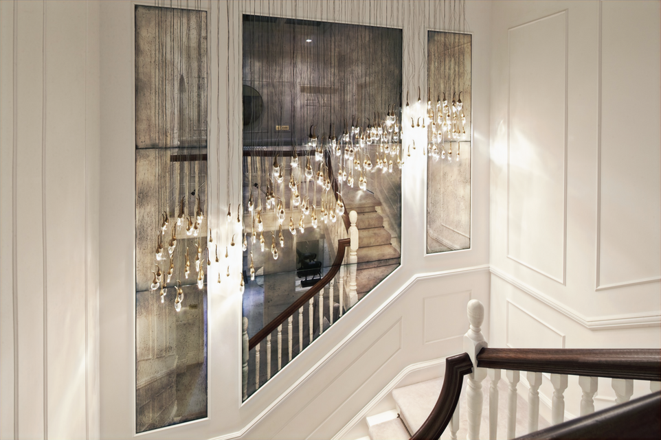 The property in Hale with Antique mirror and wall paneling above the grand staircase