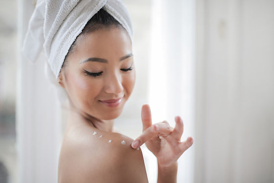 Canva - Topless Woman Putting Moisturizer.jpg
