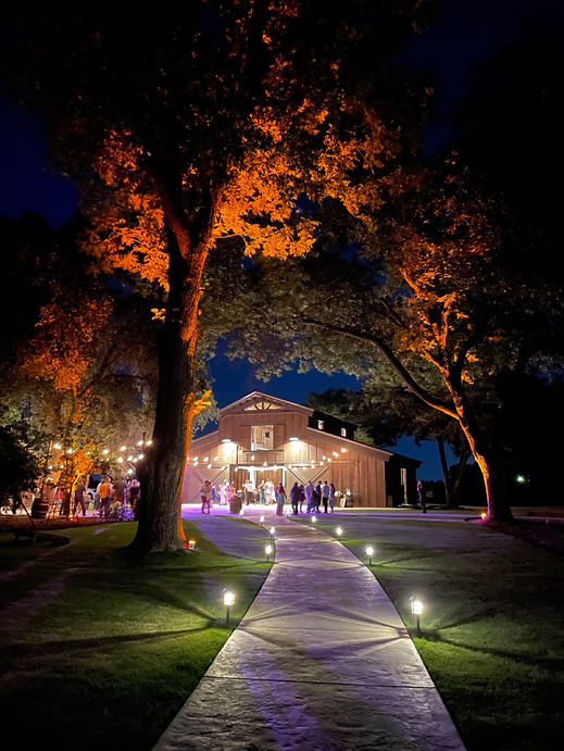 Barn with amber uplighting.jpeg