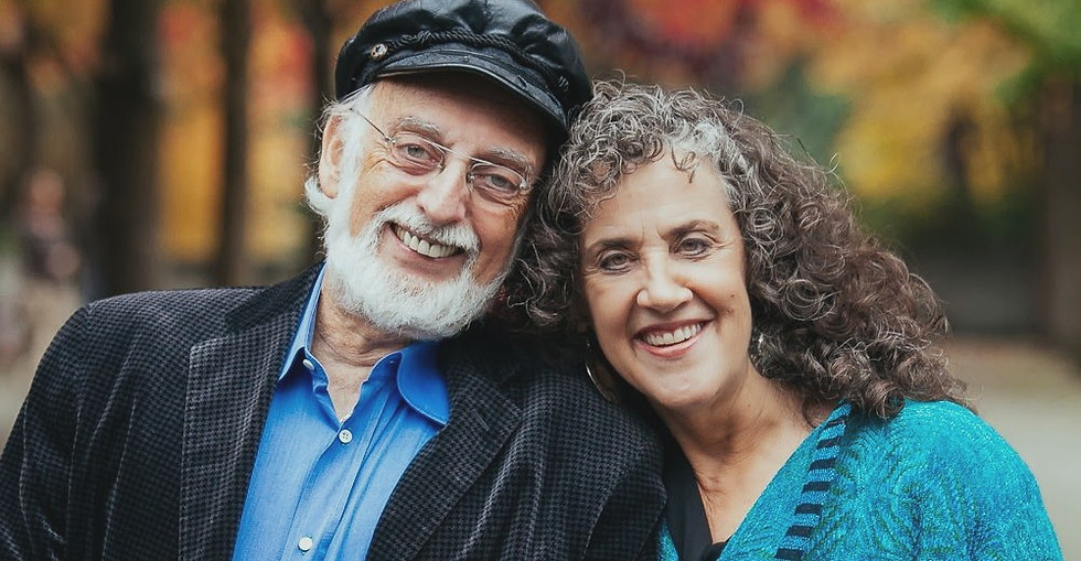 John and Julie Gottman smiling together, pioneers in relationship science and emotional connection.