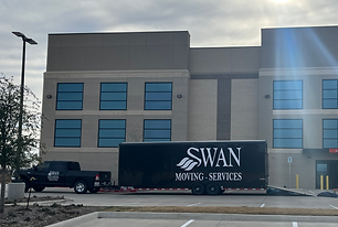 Moving truck in front of building