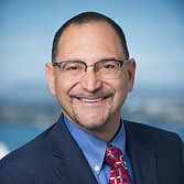 Lee Krevat headshot city background.jpg