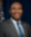 Jaime Harrison's headshot. He is wearing a suit and tie