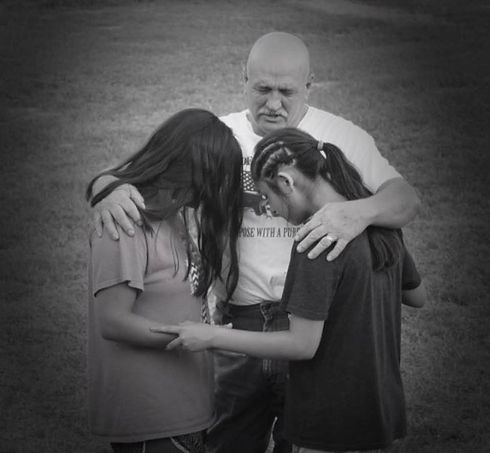 Andy_praying_with_girls_2018.jpg