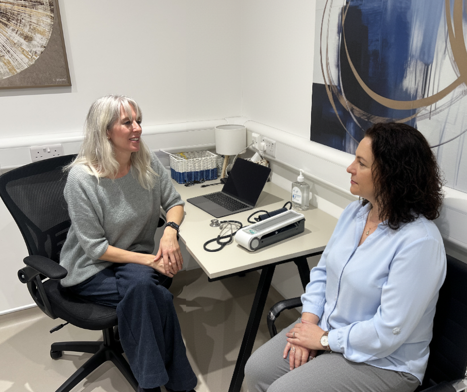 Dr Brough consulting with a female patients