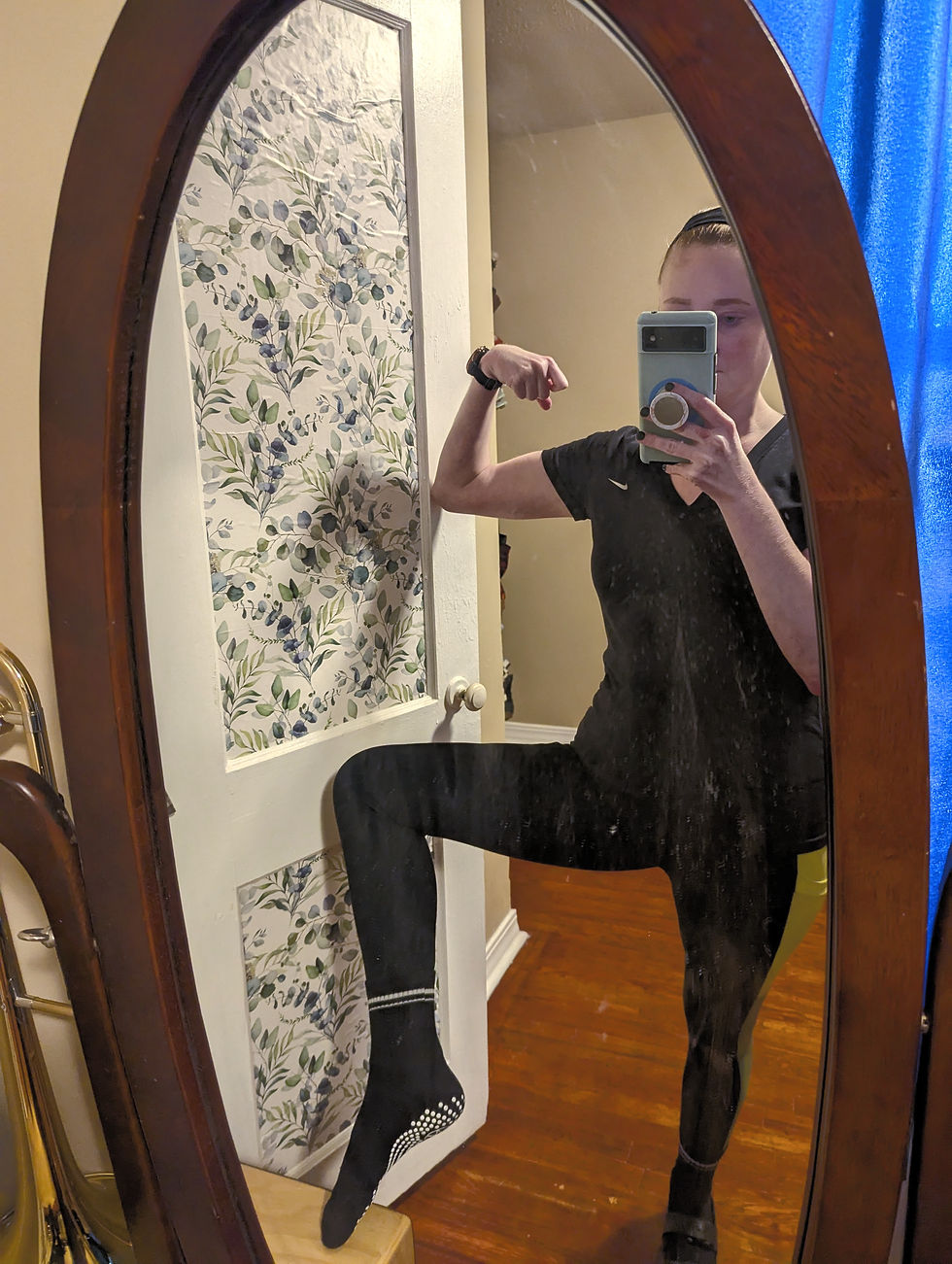 Person with workout clothes reflected in a mirror
