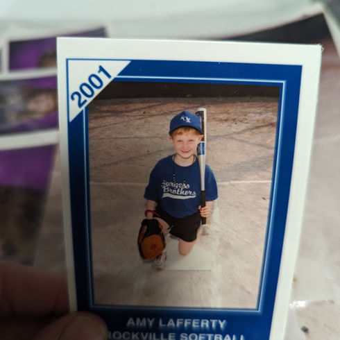 A handsome young boy with a softball uniform from 2001