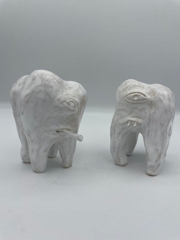 two white ceramic teeth characters