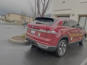 Rear view of Stallion Volkswagen Atlas Cross Sport showing California driving school license E0271