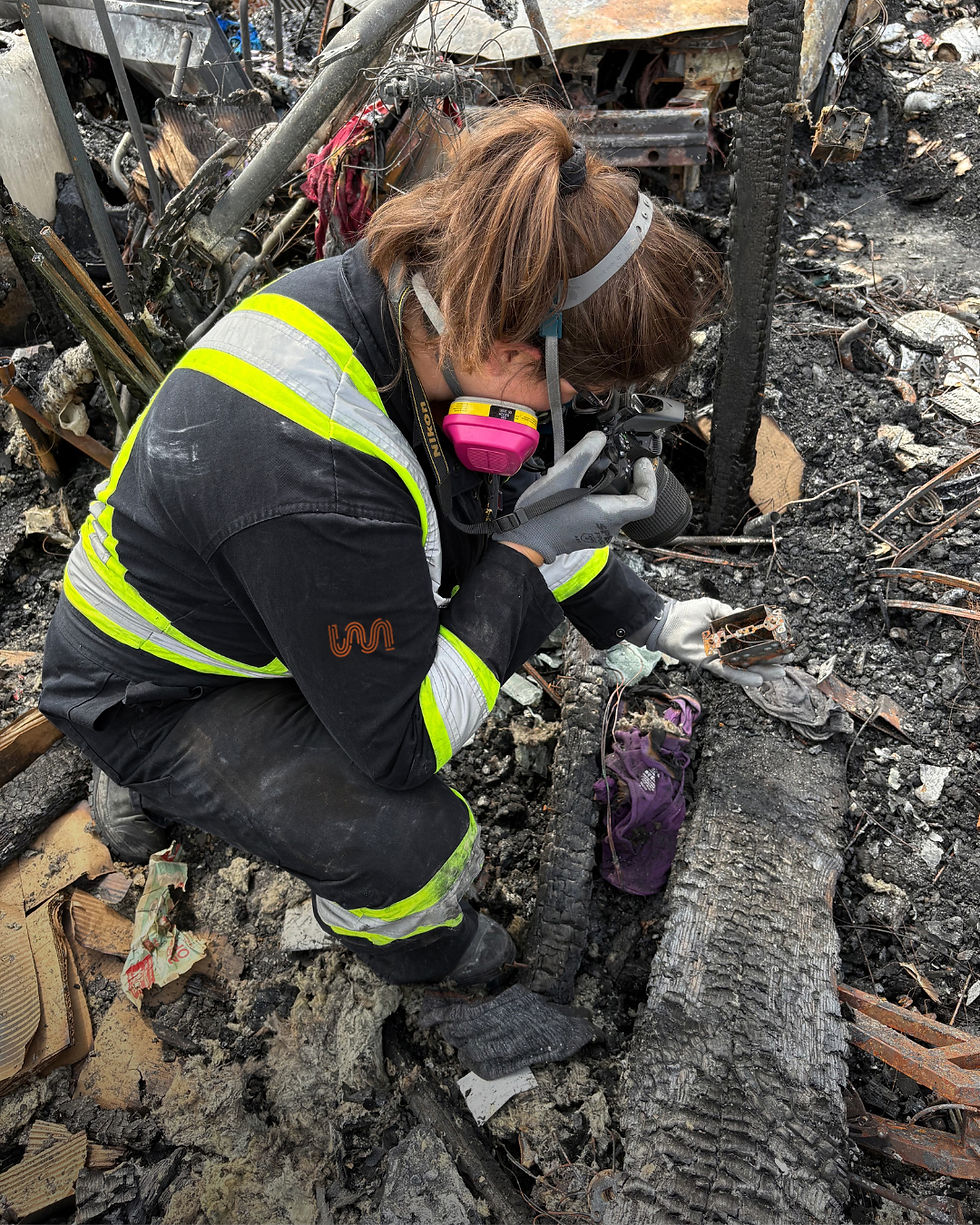 melanie on a fire scene taking photos for evidence