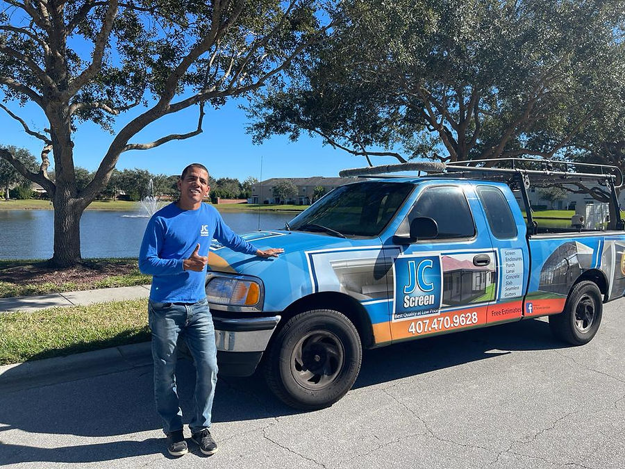 Jean standing in front of his truck