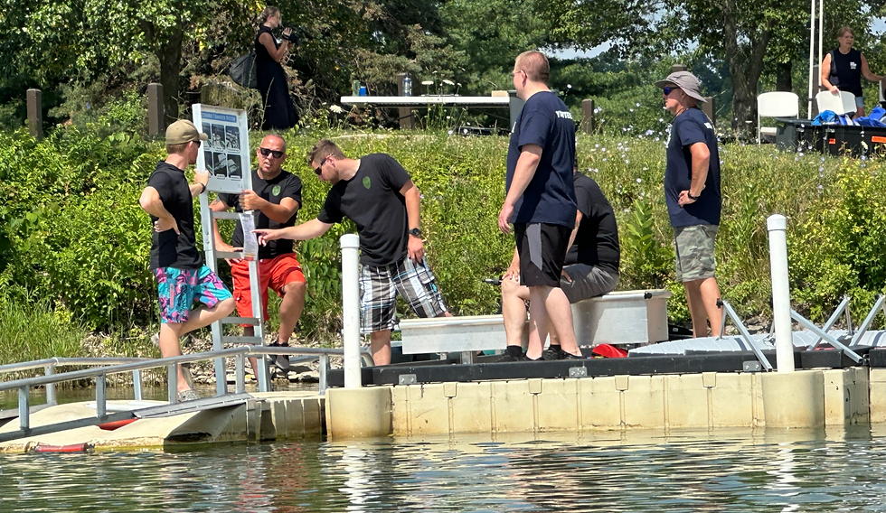 JAMPD volunteers assisting at adaptive kayak launch