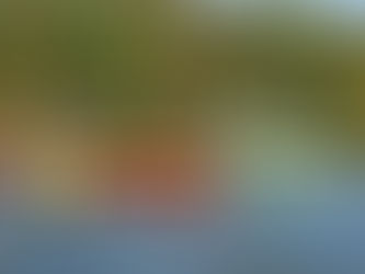 two adaptive kayakers paddling on calm water in Vermont