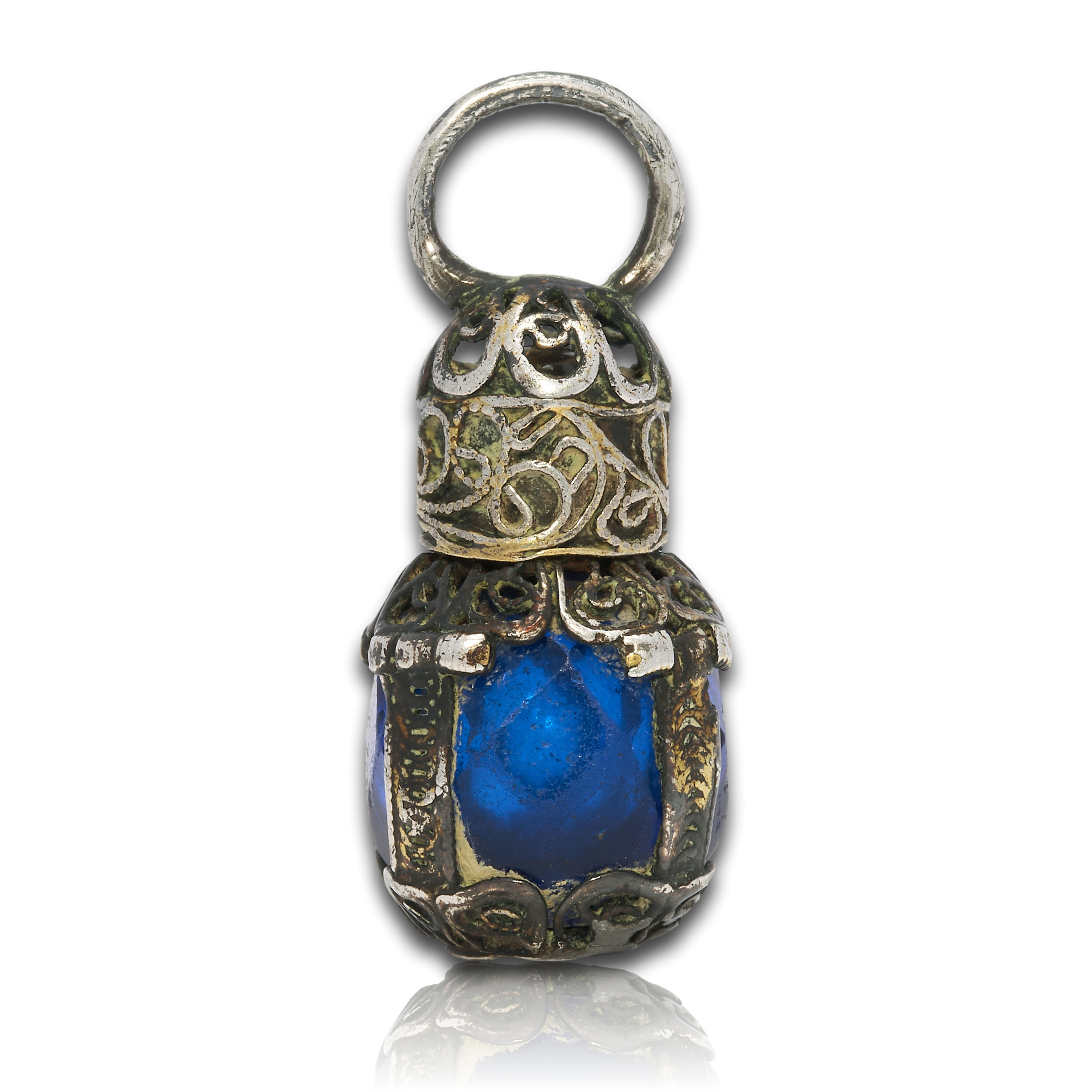 Miniature blue glass scent bottle with silver mounts. English, 17th century.
