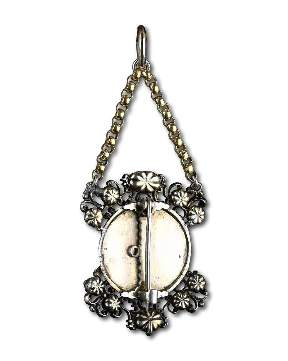 Thumbnail: Silver and gold pendant with diamonds, rubies and a cameo of Veronica’s veil.