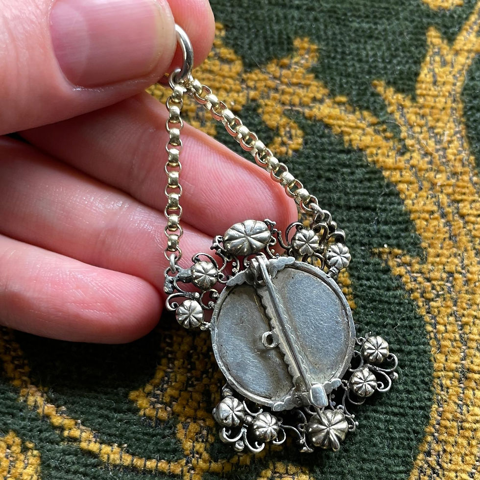 Thumbnail: Silver and gold pendant with diamonds, rubies and a cameo of Veronica’s veil.