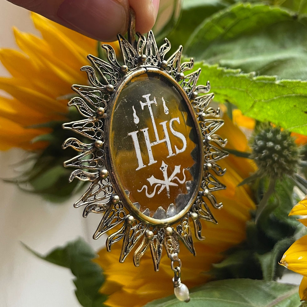 Thumbnail: Silver gilt pendant with an enamelled glass ’IHS’. Spanish, mid 17th century.
