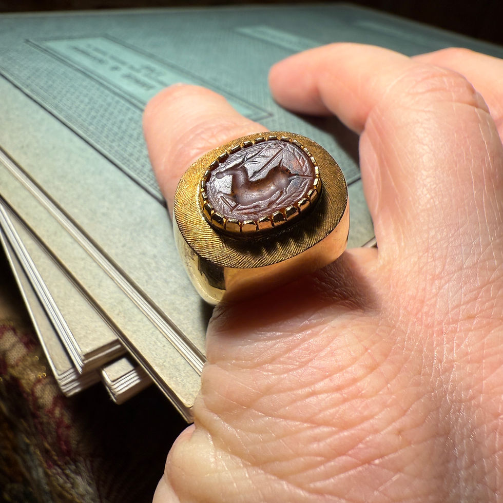 Thumbnail: Gold Ring Set with an Ancient Carnelian Scarab Depicting a Deer Hunt.