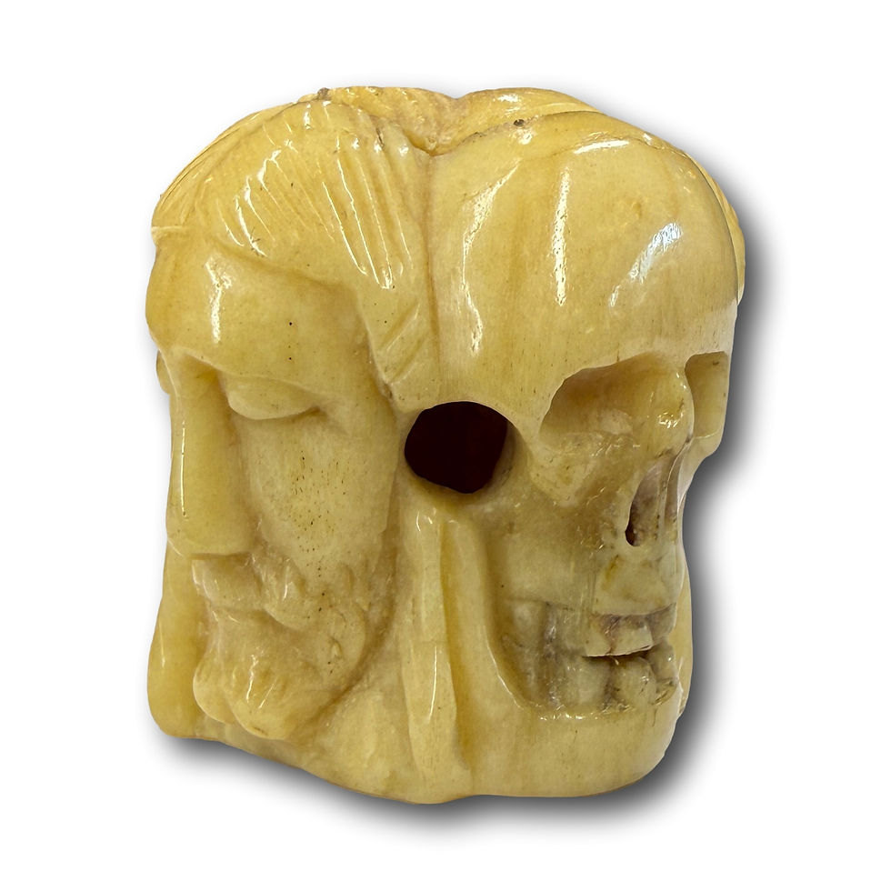 Thumbnail: Bone vanitas rosary bead carved with four heads.  French, 16th century.