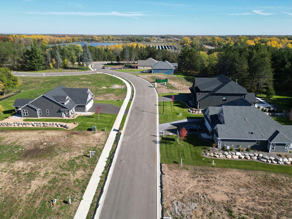 Street view of new construction homes in Forest Hills Preserve neighborhood Forest Lake MN.
