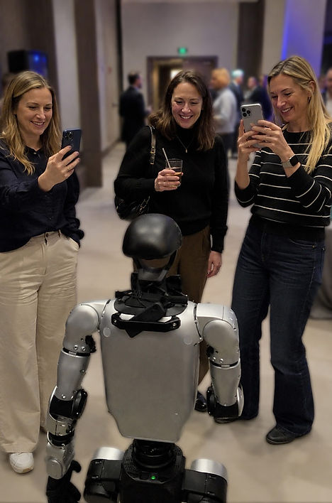 D4RYL the humanoid robot welcoming guests at a corporate networking event with David Penn’s award-winning event entertainment.