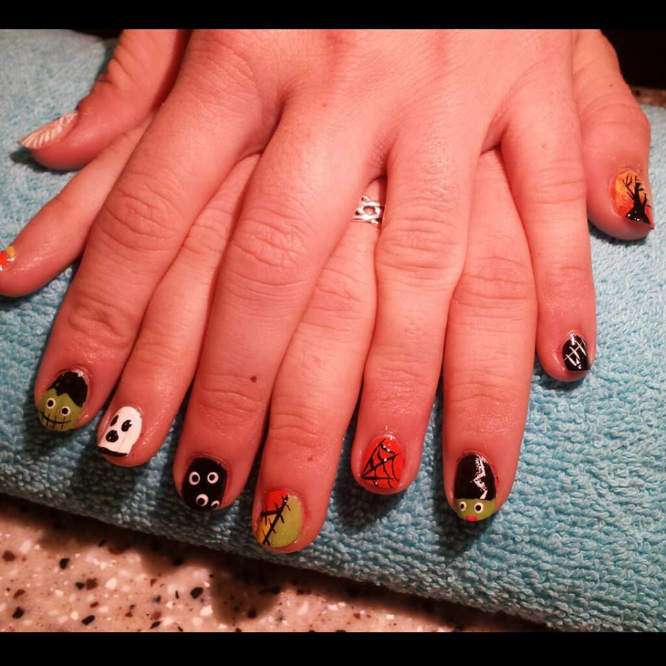 Halloween designs on natural nails.