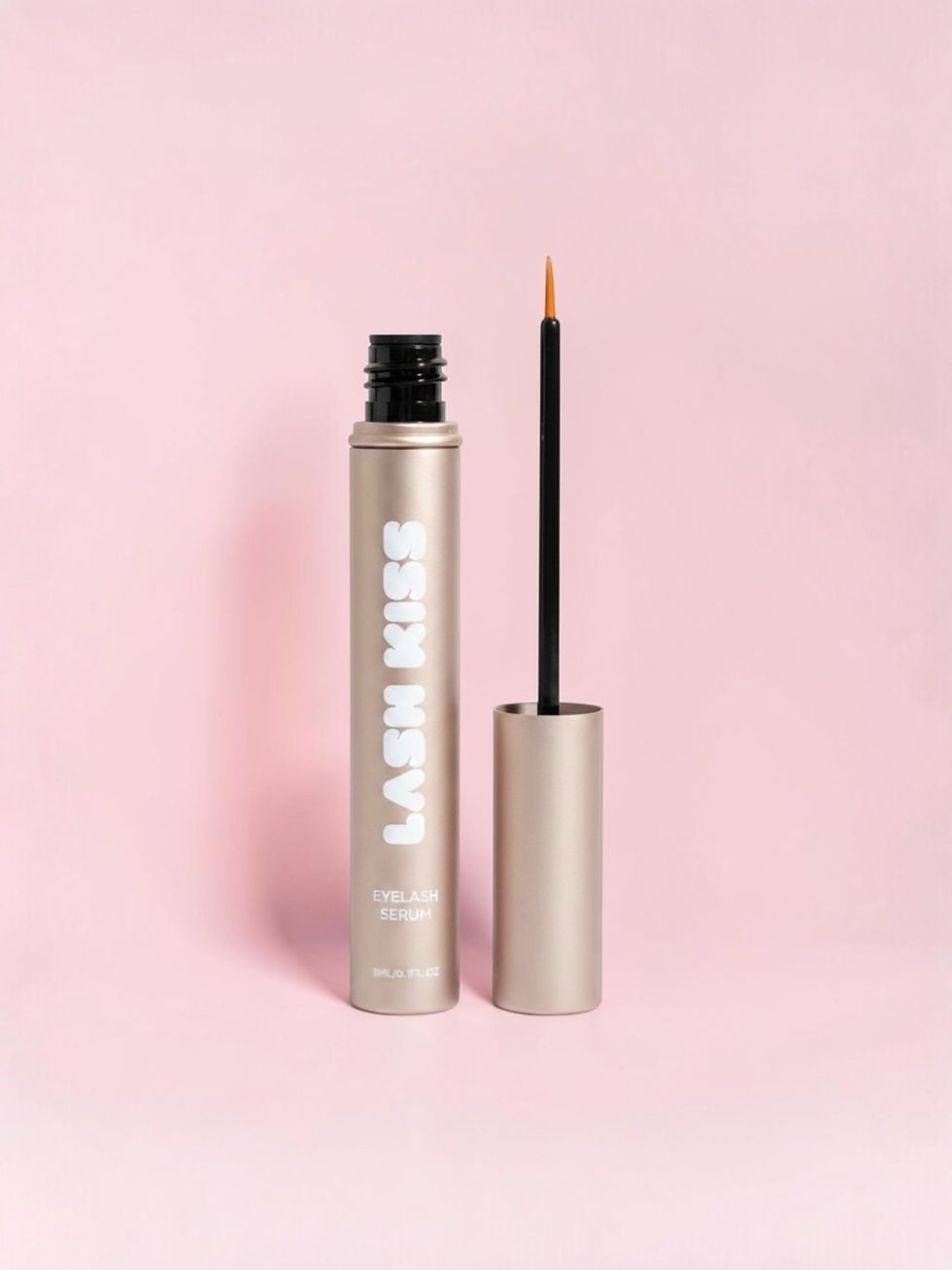 Lash Kiss serum bottle and applicator on pink background