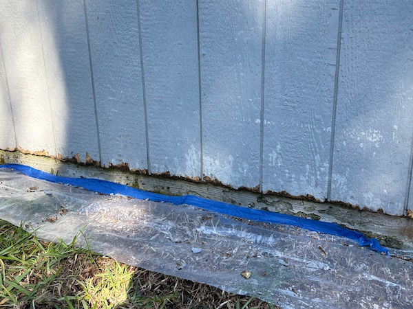 Removing decayed wood along the bottom of exterior siding to prepare for WDO repair and restoration.