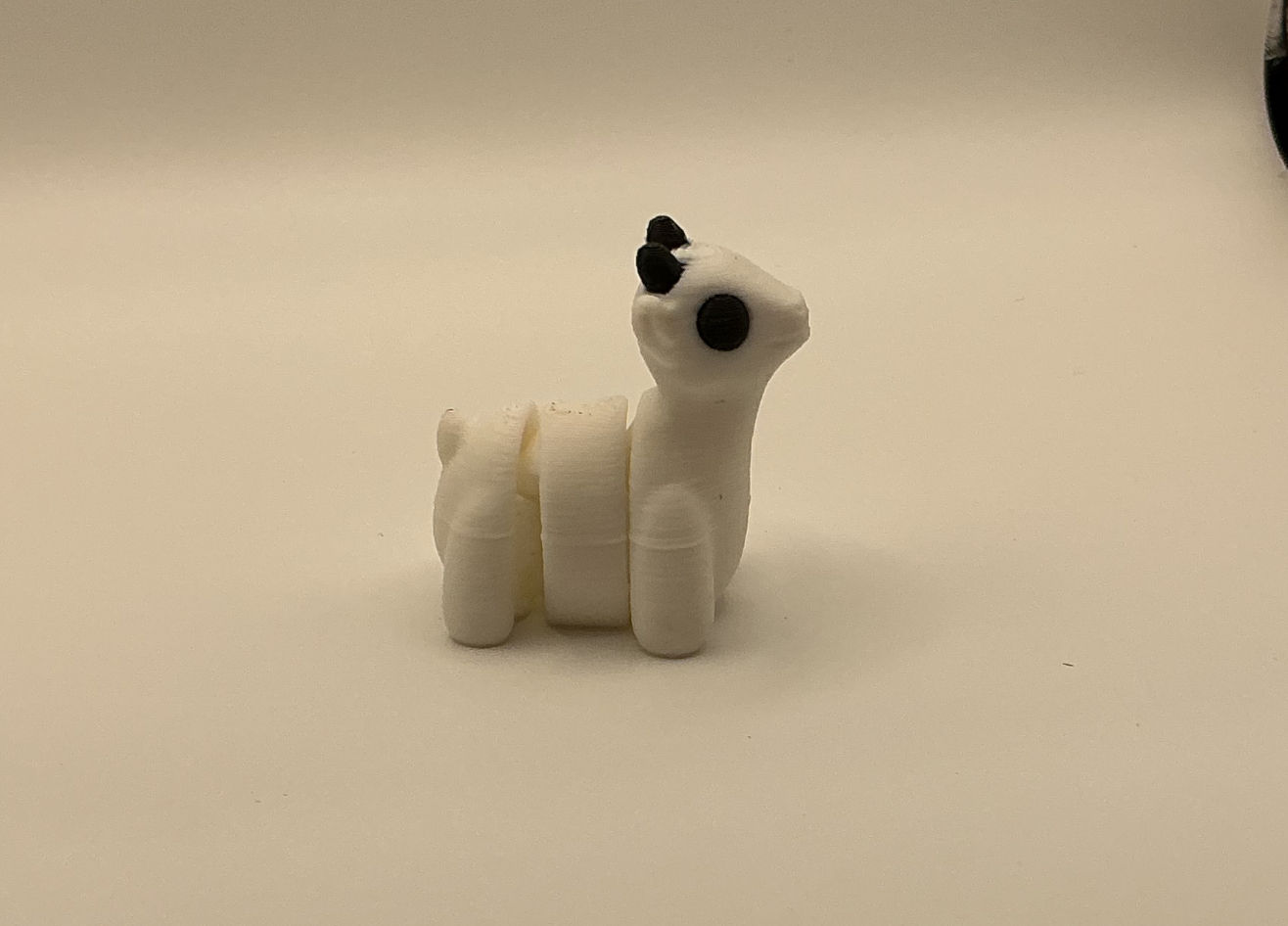 3D printed articulated goat fidget toy white with black ears