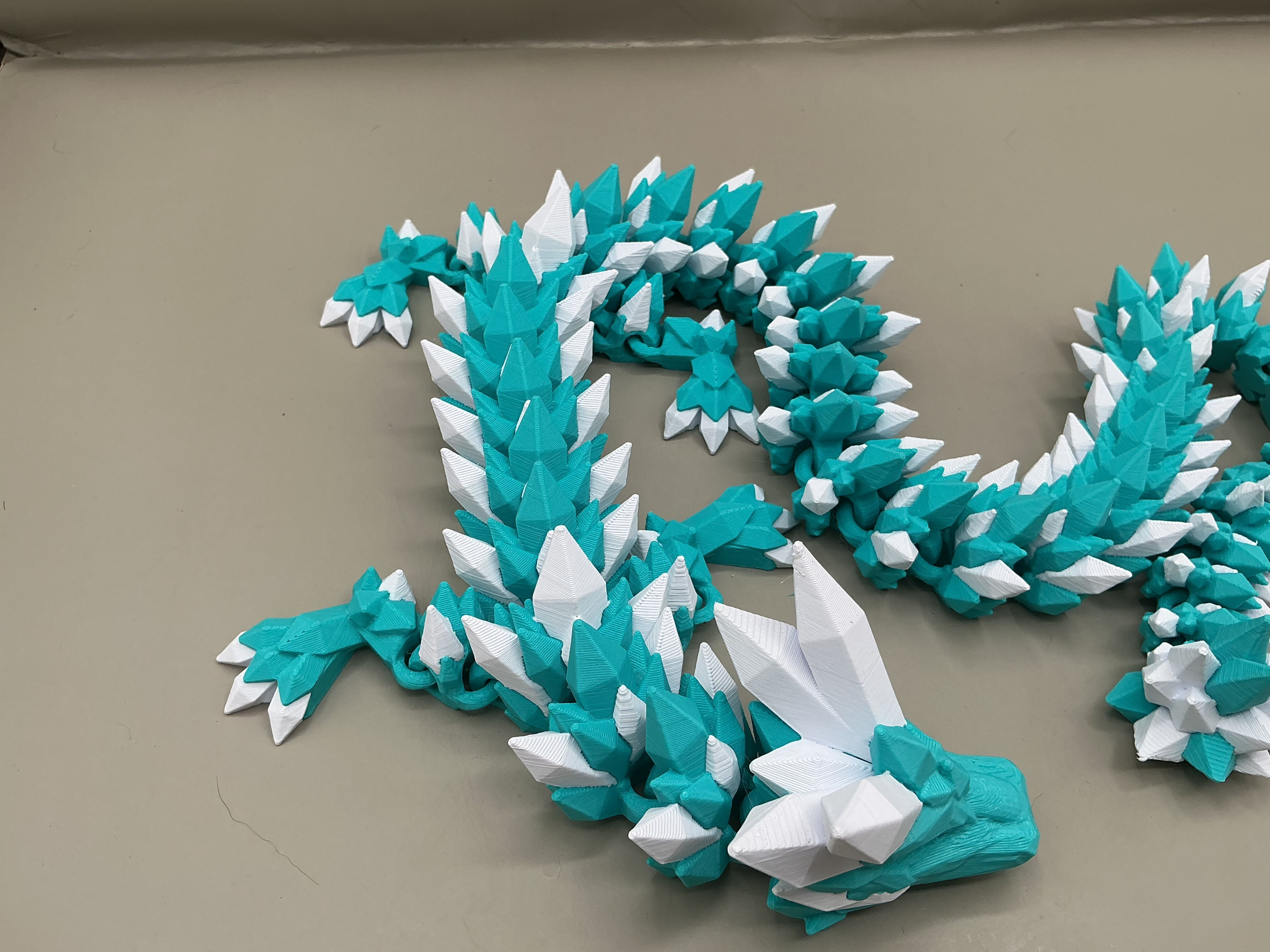 teal and white articulated crystal dragon frostbite shard dragon 3D printed