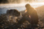 woman-sitting-on-bank-of-bitterroot-river-stroking-2022-03-04-01-42-47-utc.jpg