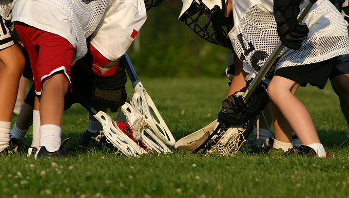 lacrosse-players-in-a-scrum-on-grass