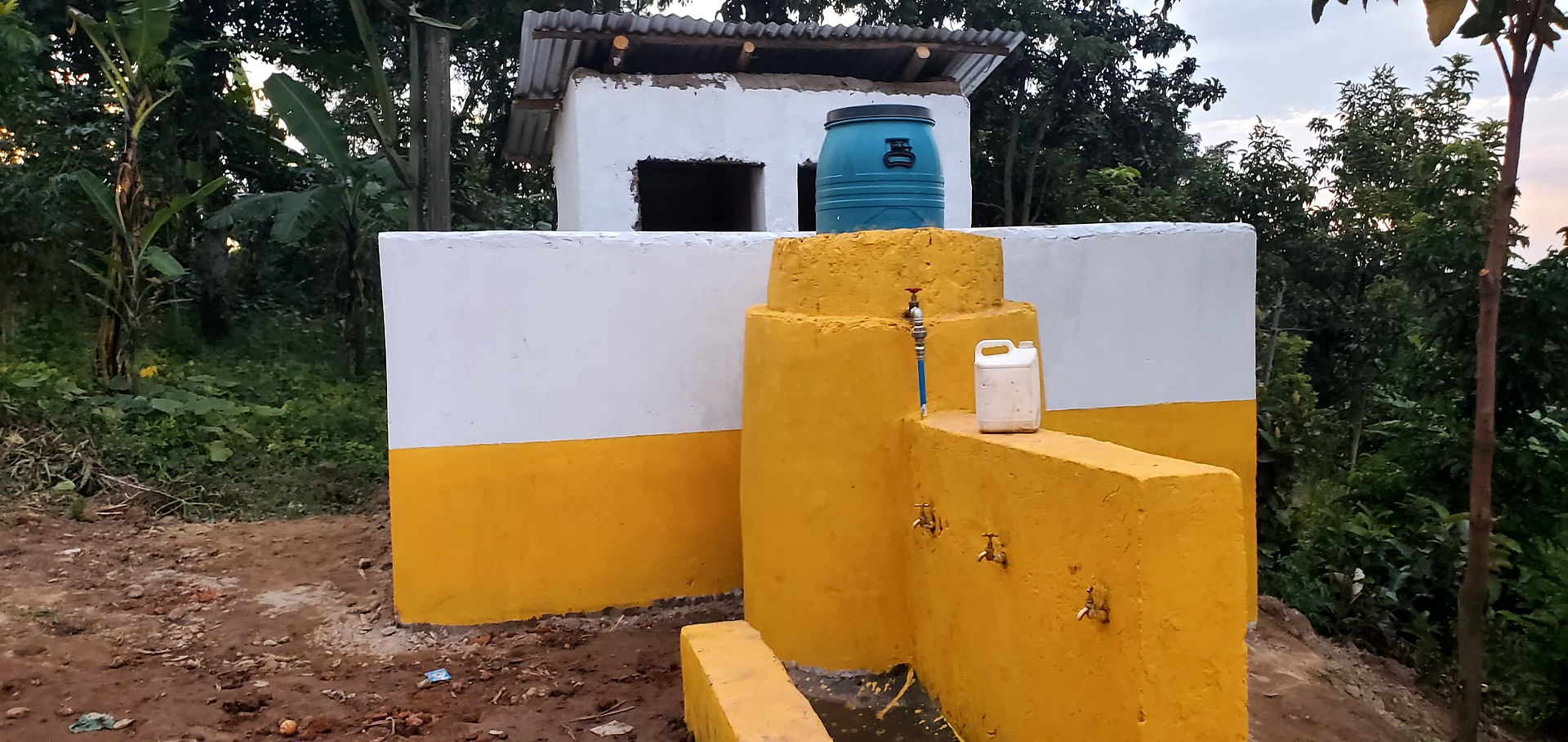 Newly built water facility with tap and tank