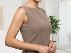 Close-up of toned, smooth upper arms of a woman after arm lift surgery in a clean and elegant clinic