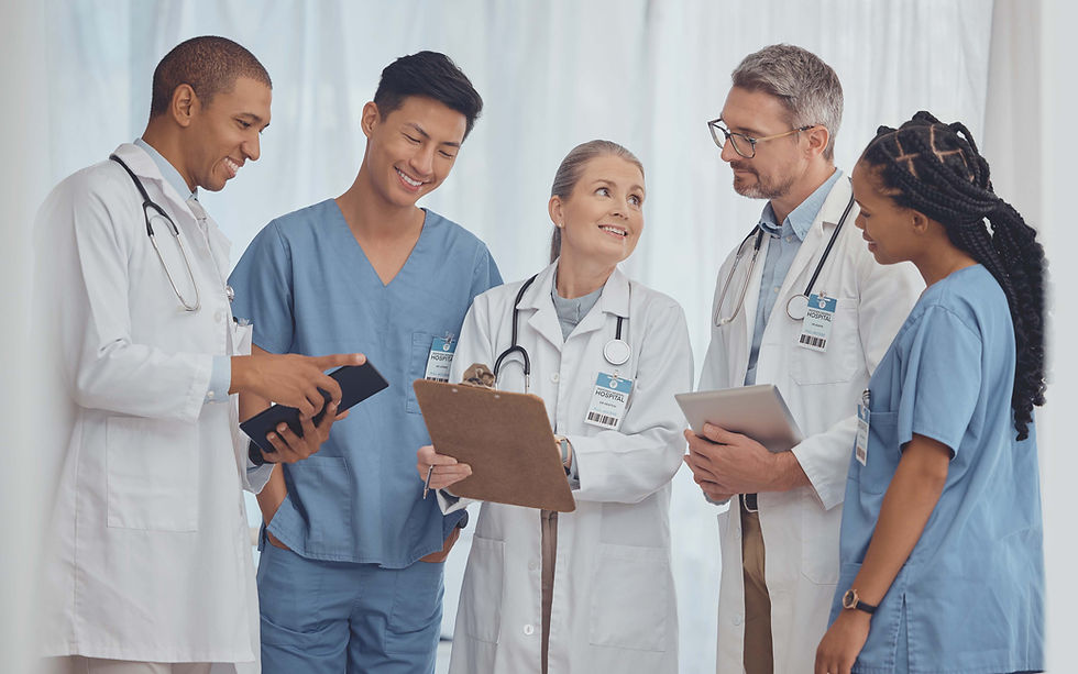 Doctors and Nurses Standing in Group Smiling