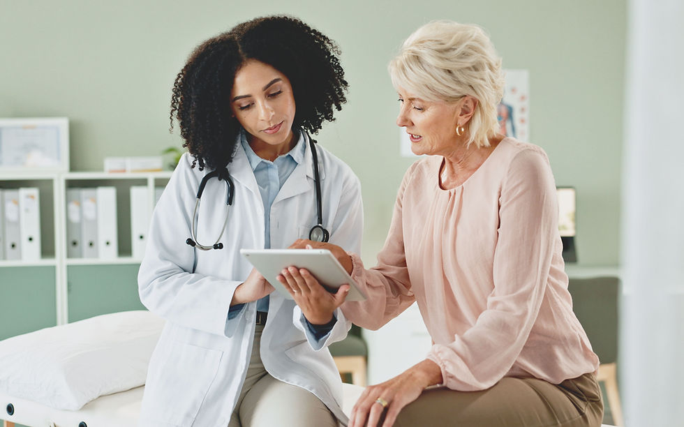 Doctor Reviewing Charts with Patient on Tablet