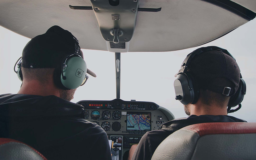 Two Pilots in Cockpit of Airplane