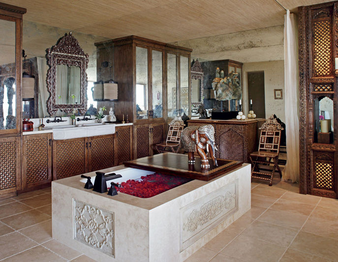 Beautiful mix of traditional indian carved furnishings in a modern high rise apartment