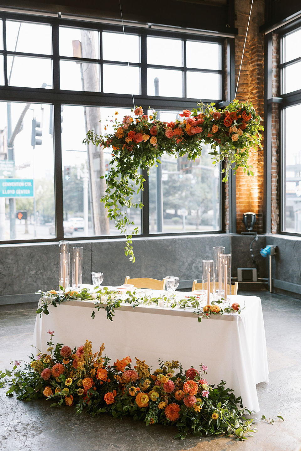sweetheart table with floral installation backdrop at Leftbank Annex