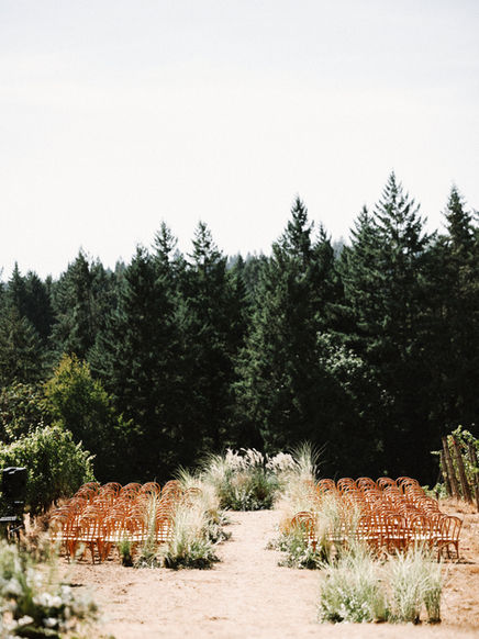 Luxury winery wedding ceremony with a growing meadow aisle