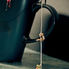 Creative image of miniature climbers on a teabag string hanging from a mug, used as a metaphor for pressure and preparation in a Cafcass safeguarding interview.