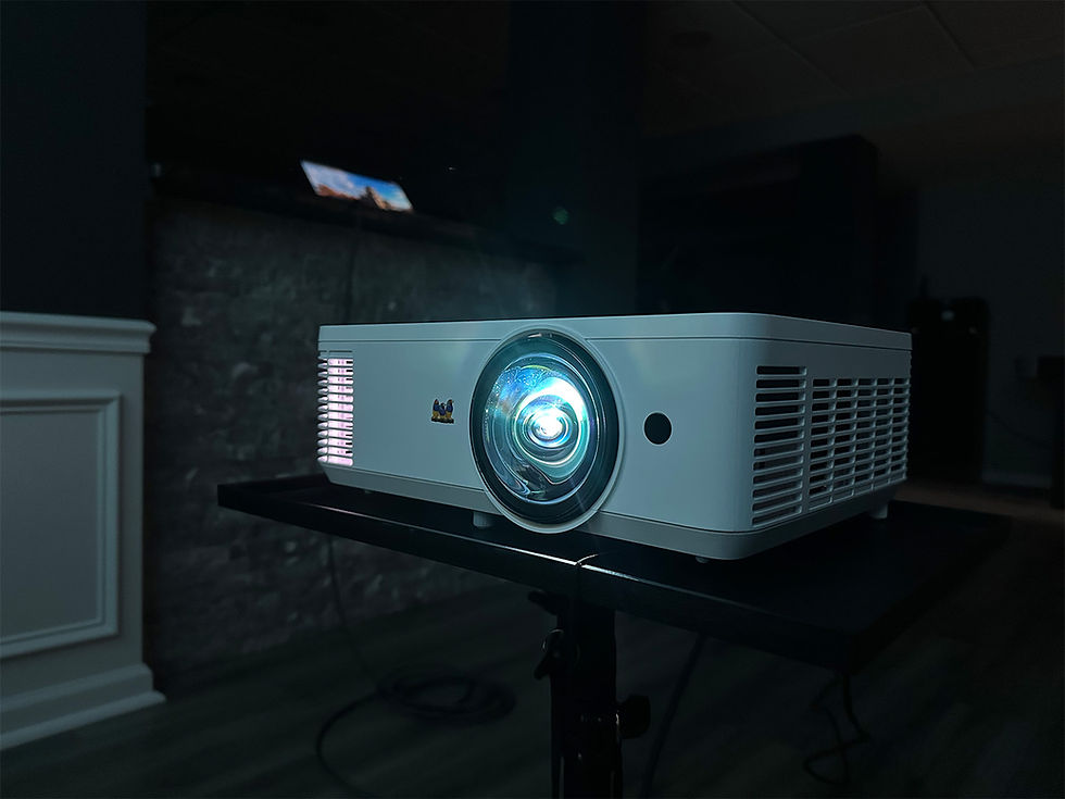 ViewSonic short-throw projector powered on during an indoor video playback.