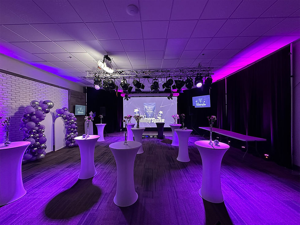 Purple uplighting and stage wash for branded cocktail party or product showcase.