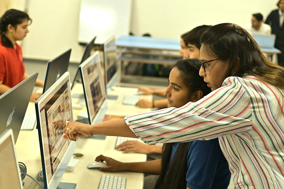 Students working on computers in a classroom tech lab