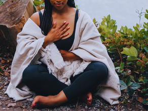 Woman with hands on chest