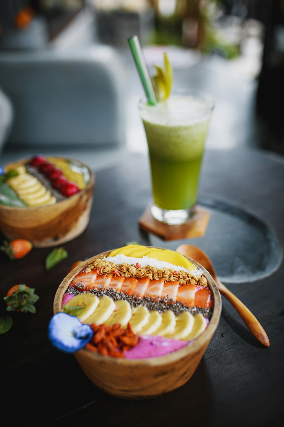 Healthy smoothie bowl and fresh juice after surfing in Tamarindo Costa Rica relaxing post surf lifestyle
